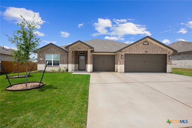 6105 Dorado Dr, Killeen, TX 76542 - view of front facade with brick siding, a garage, and driveway