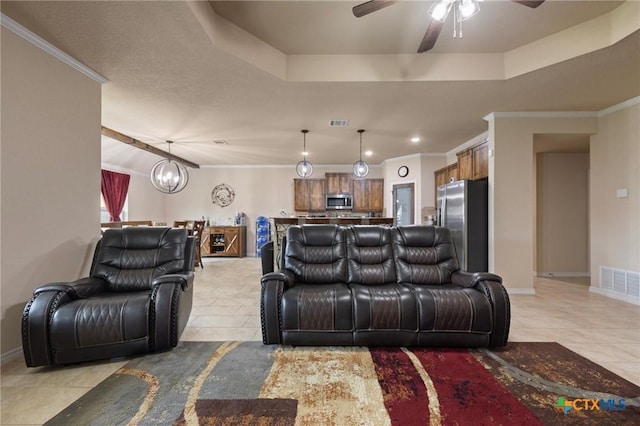 6105 Dorado Dr, Killeen, TX 76542 - living room featuring light tile patterned floors, visible vents, baseboards, and ceiling fan with notable chandelier