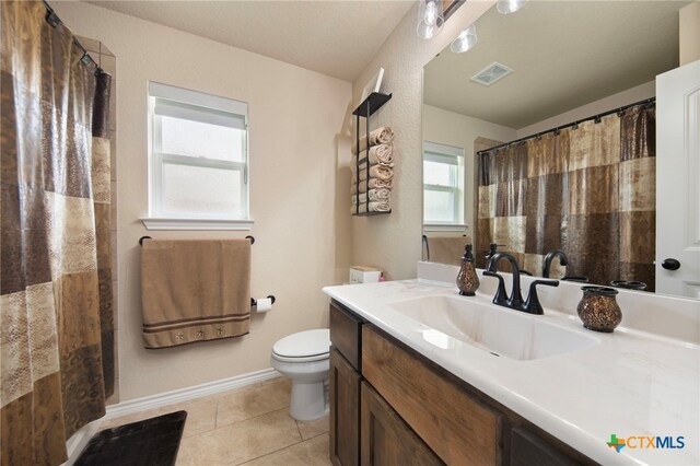 6105 Dorado Dr, Killeen, TX 76542 - bathroom with toilet, a shower with shower curtain, tile patterned floors, visible vents, and vanity