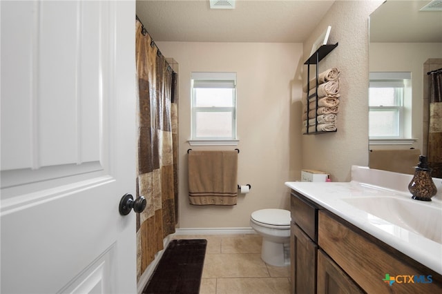 6105 Dorado Dr, Killeen, TX 76542 - bathroom featuring toilet, tile patterned flooring, vanity, and plenty of natural light