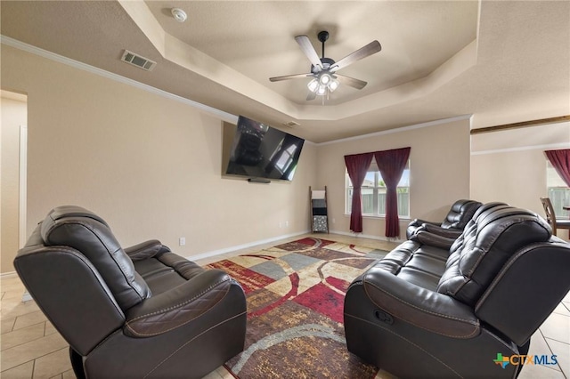 6105 Dorado Dr, Killeen, TX 76542 - living room featuring a tray ceiling, baseboards, a ceiling fan, and visible vents