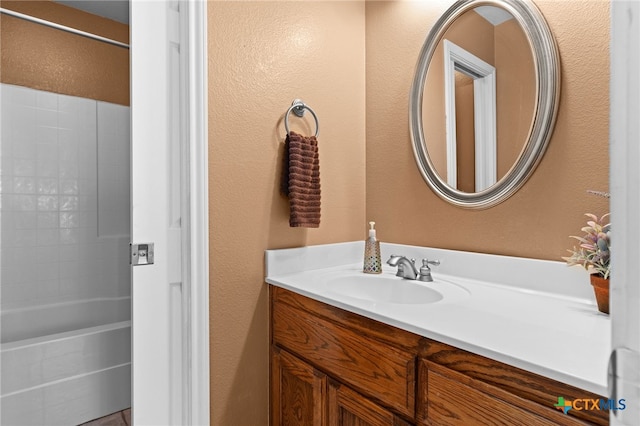 1712 Indian Camp Trl, Copperas Cove, TX 76522 - full bathroom featuring vanity, a textured wall, and shower / washtub combination