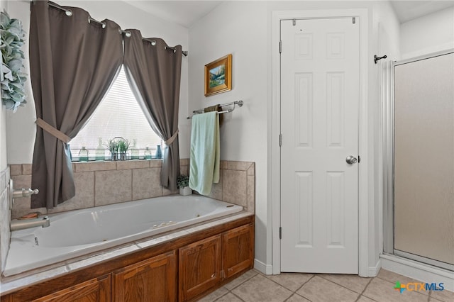 1712 Indian Camp Trl, Copperas Cove, TX 76522 - bathroom with a whirlpool tub, tile patterned floors, and a stall shower