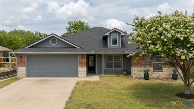 1712 Indian Camp Trl, Copperas Cove, TX 76522 - view of front of property with stone siding, a garage, roof with shingles, and driveway