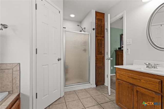 1712 Indian Camp Trl, Copperas Cove, TX 76522 - bathroom featuring a stall shower, vanity, tile patterned flooring, a tub, and a closet