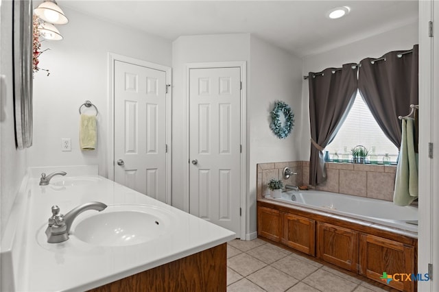 1712 Indian Camp Trl, Copperas Cove, TX 76522 - full bathroom with tile patterned floors, double vanity, and a garden tub