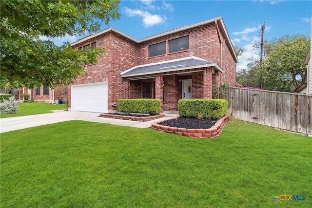 view of front of property featuring a garage and a front yard