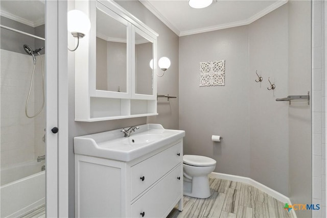 full bathroom featuring ornamental molding, toilet, shower / bath combination, wood-type flooring, and vanity