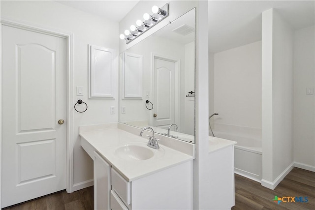 bathroom featuring vanity and hardwood / wood-style floors