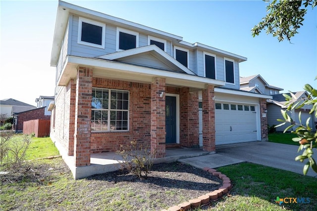 view of front of property featuring covered porch and a garage