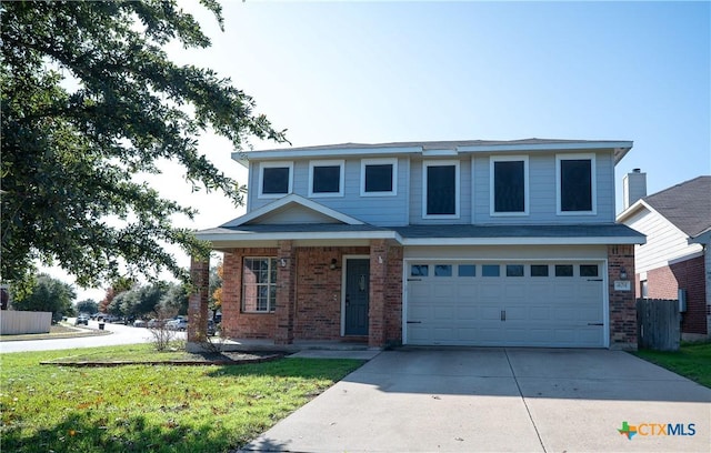 front of property with a front yard and a garage