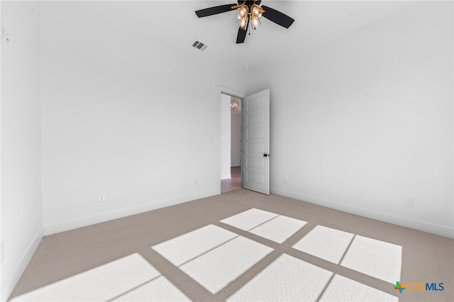 spare room with light colored carpet and ceiling fan