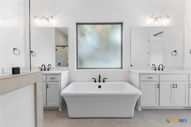 bathroom featuring vanity, plus walk in shower, and tile patterned floors