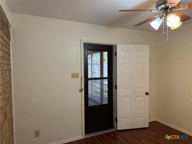 entrance foyer with dark hardwood / wood-style flooring and ceiling fan