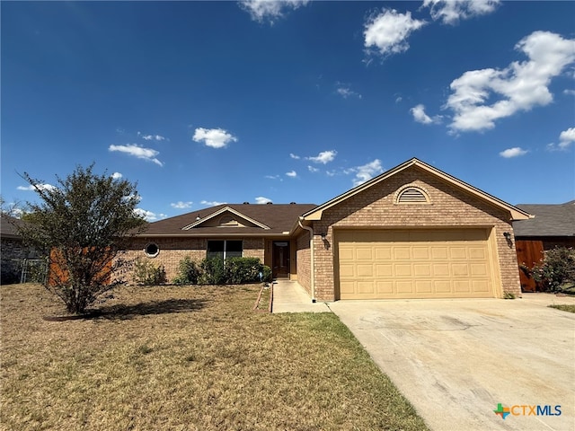 single story home featuring a garage and a front lawn