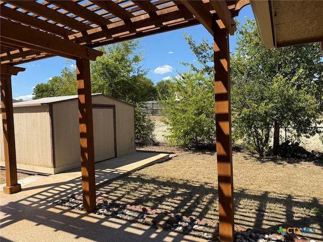 view of patio / terrace featuring a pergola and a shed