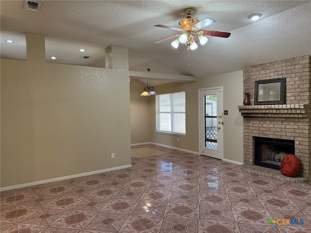 unfurnished living room with a brick fireplace, a textured ceiling, ceiling fan, and vaulted ceiling