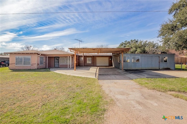 ranch-style home featuring a garage and a front yard