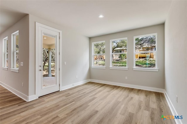 unfurnished room with light hardwood / wood-style flooring