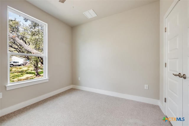 empty room with carpet flooring