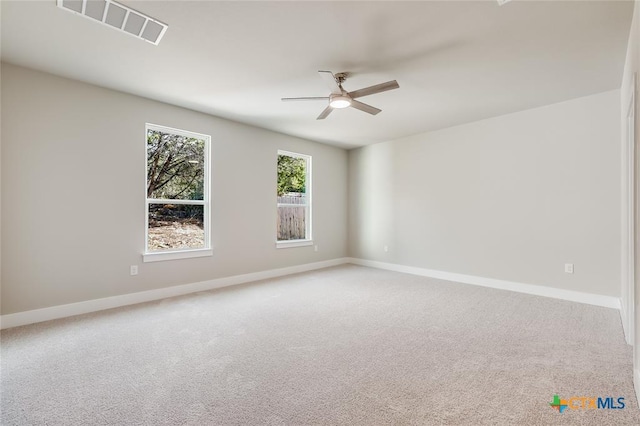 carpeted empty room featuring ceiling fan