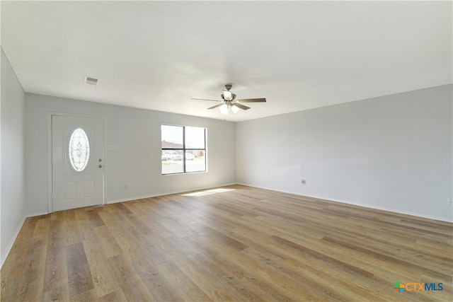 2703 Casey Dr, Killeen, TX 76543 - foyer entrance featuring ceiling fan, light wood finished floors, and baseboards