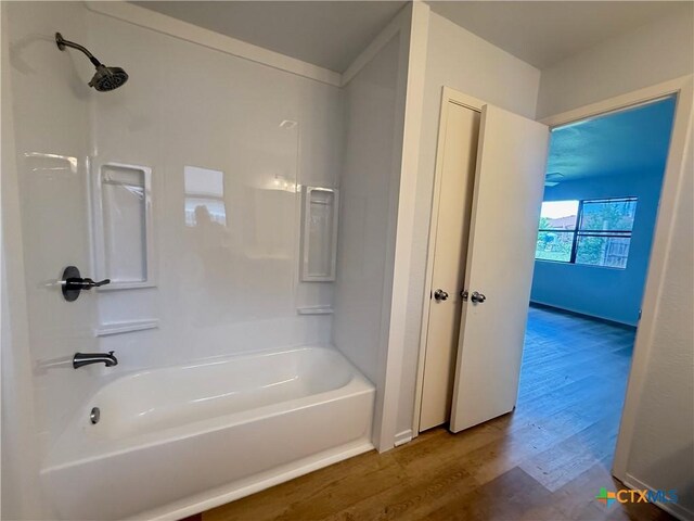2703 Casey Dr, Killeen, TX 76543 - bathroom featuring wood finished floors and tub / shower combination