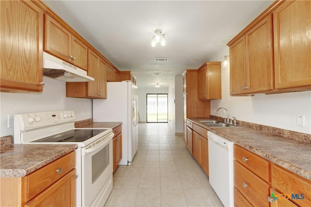2703 Casey Dr, Killeen, TX 76543 - kitchen featuring white appliances, a sink, under cabinet range hood, light tile patterned floors, and light countertops