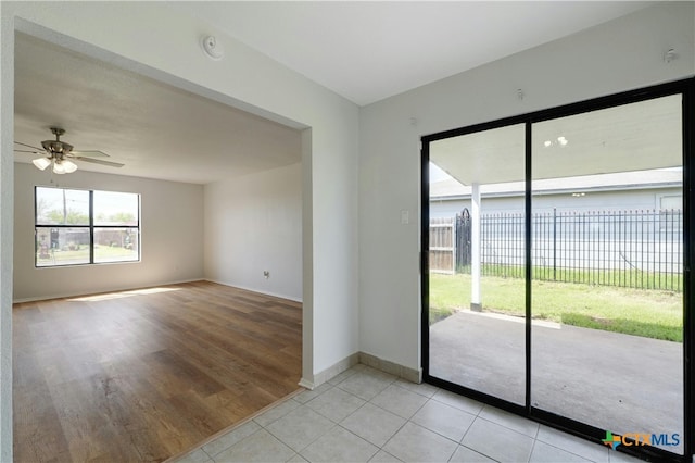 2703 Casey Dr, Killeen, TX 76543 - spare room with baseboards, ceiling fan, light tile patterned floors, and a smoke detector