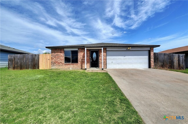 2703 Casey Dr, Killeen, TX 76543 - view of front facade with driveway, brick siding, and a garage