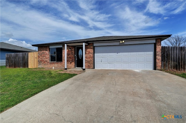 2703 Casey Dr, Killeen, TX 76543 - ranch-style home featuring brick siding, concrete driveway, and an attached garage