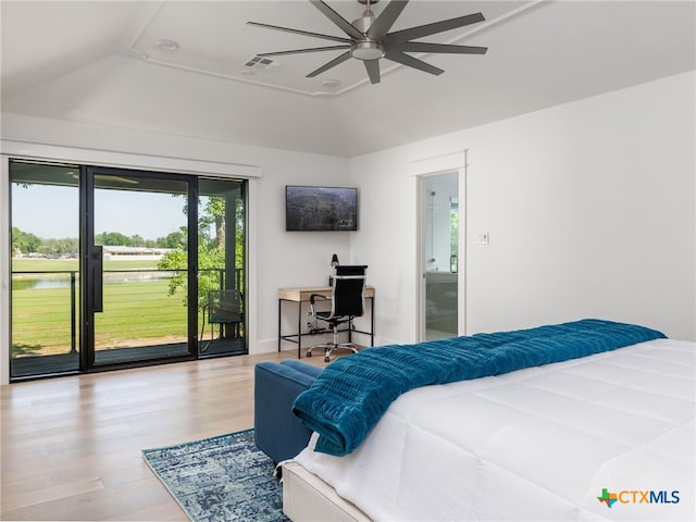 3415 Chisholm Trl, Salado, TX 76571 - bedroom featuring lofted ceiling, wood finished floors, visible vents, and access to exterior