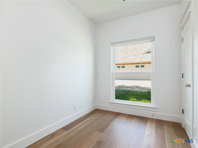 3415 Chisholm Trl, Salado, TX 76571 - spare room featuring baseboards, a healthy amount of sunlight, and wood finished floors