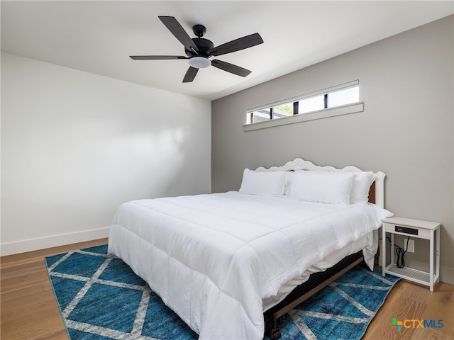 3415 Chisholm Trl, Salado, TX 76571 - bedroom with wood finished floors, baseboards, and ceiling fan