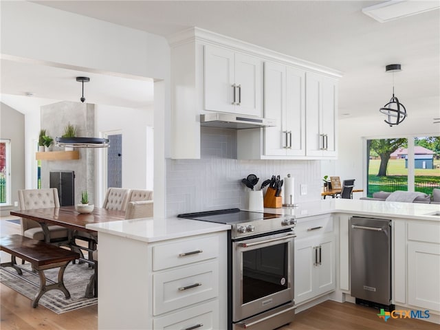 3415 Chisholm Trl, Salado, TX 76571 - kitchen featuring a peninsula, under cabinet range hood, light wood-style flooring, backsplash, and appliances with stainless steel finishes