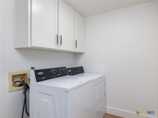 3415 Chisholm Trl, Salado, TX 76571 - washroom featuring cabinet space, independent washer and dryer, and baseboards