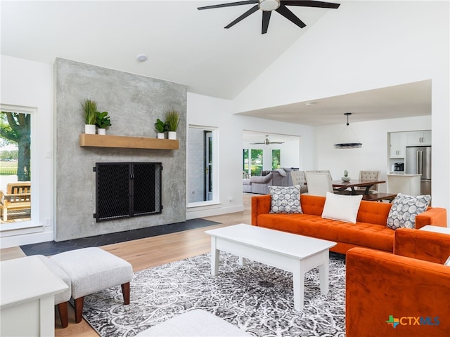 3415 Chisholm Trl, Salado, TX 76571 - living room with a ceiling fan, a healthy amount of sunlight, and a fireplace