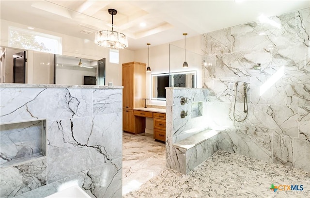 full bathroom with marble finish floor, a marble finish shower, a raised ceiling, and vanity