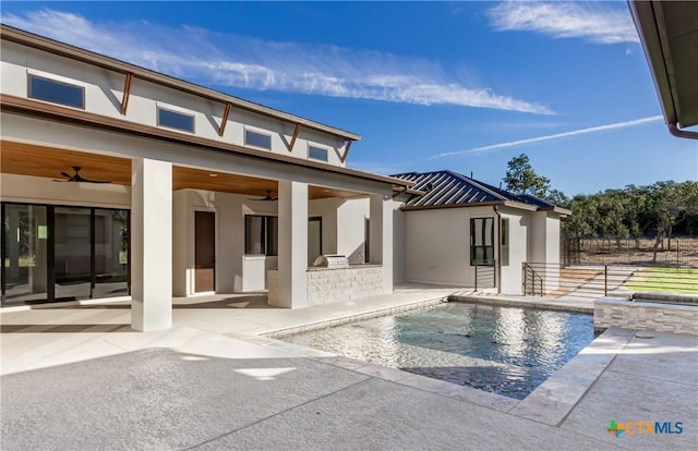 exterior space with area for grilling, fence, a ceiling fan, stucco siding, and a patio area