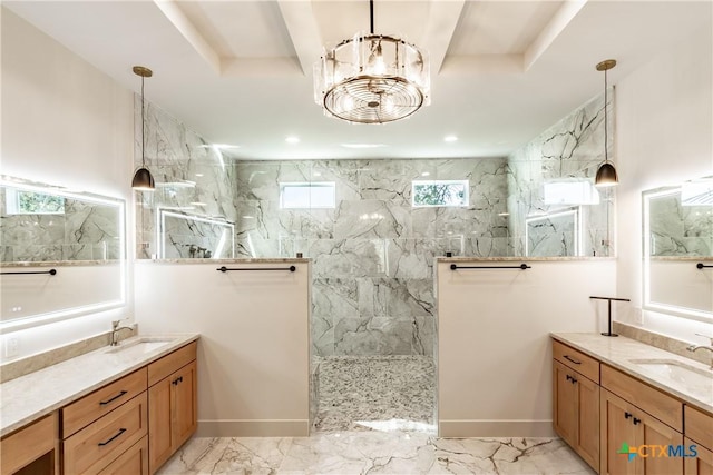 bathroom featuring marble finish floor, two vanities, a sink, and a marble finish shower