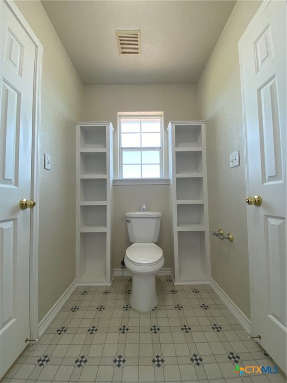 bathroom featuring toilet