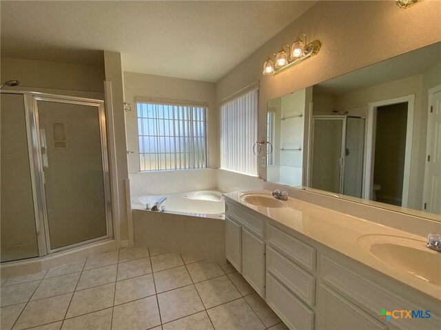 full bathroom featuring vanity, tile patterned floors, toilet, and separate shower and tub