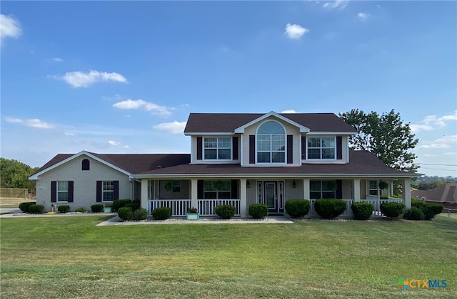 view of front of property with a front lawn and covered porch