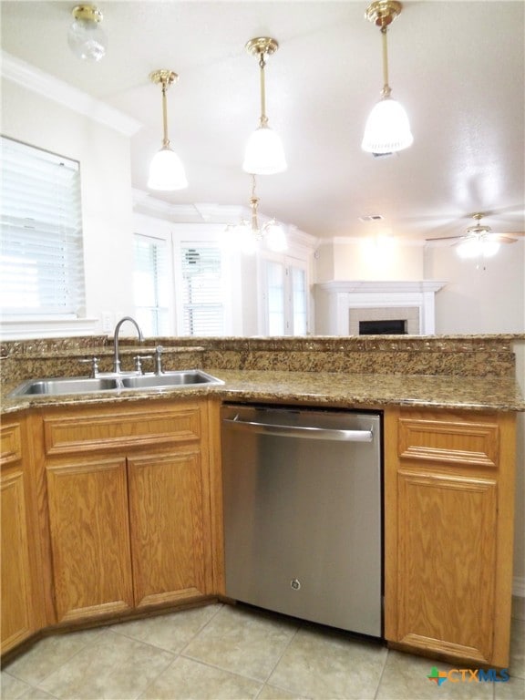 kitchen featuring sink, decorative light fixtures, dishwasher, and ornamental molding