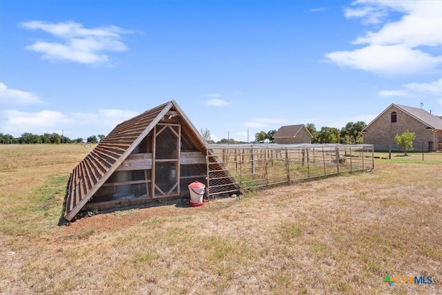 view of outbuilding featuring a rural view