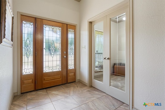 interior space with french doors and plenty of natural light