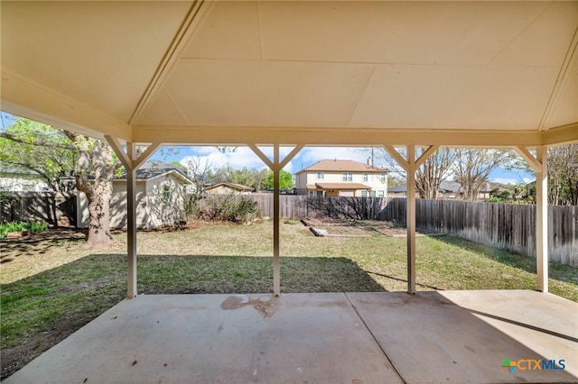 7016 Albacete Ln, Round Rock, TX 78681 - fenced backyard featuring a patio and an outbuilding