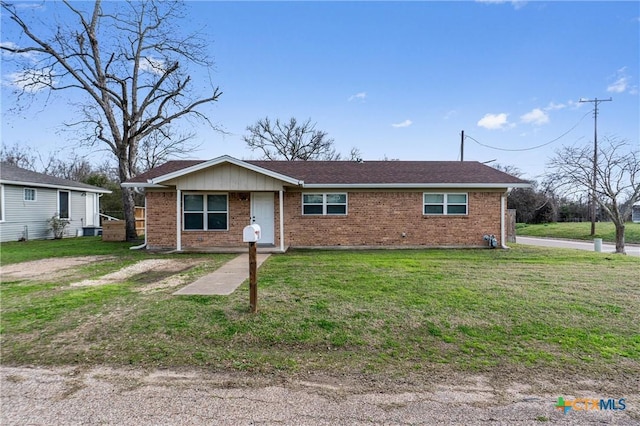 ranch-style house with a front lawn