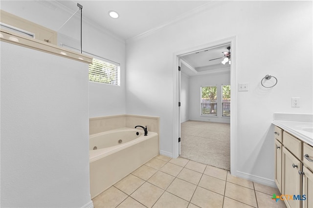 bathroom with tile patterned flooring, ceiling fan, vanity, crown molding, and a washtub