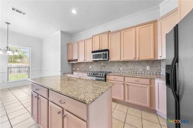 kitchen with stainless steel appliances, a notable chandelier, tasteful backsplash, pendant lighting, and light brown cabinetry